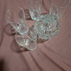 6 glasses, 3 mediums, 3 Large One plus a sugargar container.