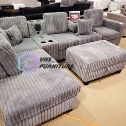 Gray sectional sofa with media console and cup holders USB