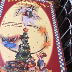 Balancing Snowman Rocks Back-And-Forth With A Wet Counterweight