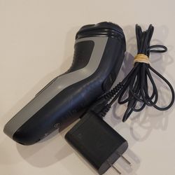 Philips Norelco Series 1000 S1211 Men's  Wet & Dry Electric Shaver. 
Pre-owned, in very good working and cosmetic shape. Functionality 10 out 
of 10. 