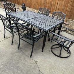 Outdoor Patio Table And Six Chairs( Two Swivel) Some Small Rust Spots But Functions( Paid 799.00 @ Home Depot 2021)