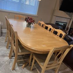 Wood Dining Table With 2 Leaves And 8 Padded Chairs