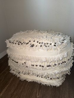 White upholstered ottoman / pouf