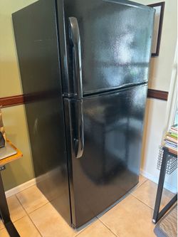 Black refrigerator $100