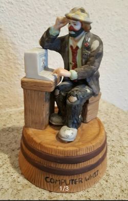 Vintage Emmett Kelly Jr Figurine "Computer Whiz" with stand. This vintage collectible is from flambr