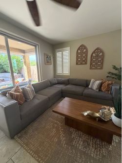 Modern, clean sofas with a rug and wall art included — only $1300!