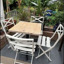 outdoor iron, white folding chairs with a waterproof outdoor gorgeous pub table