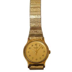 womans goldtone Bulava watch with stretch band 1990s 