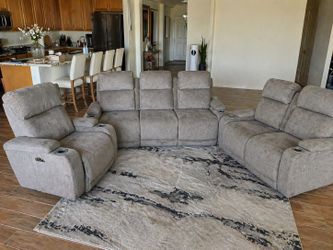 Three piece gray power reclining living room set
