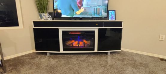 TV media console with sound bar and fireplace