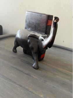 Carved elephant with carved book