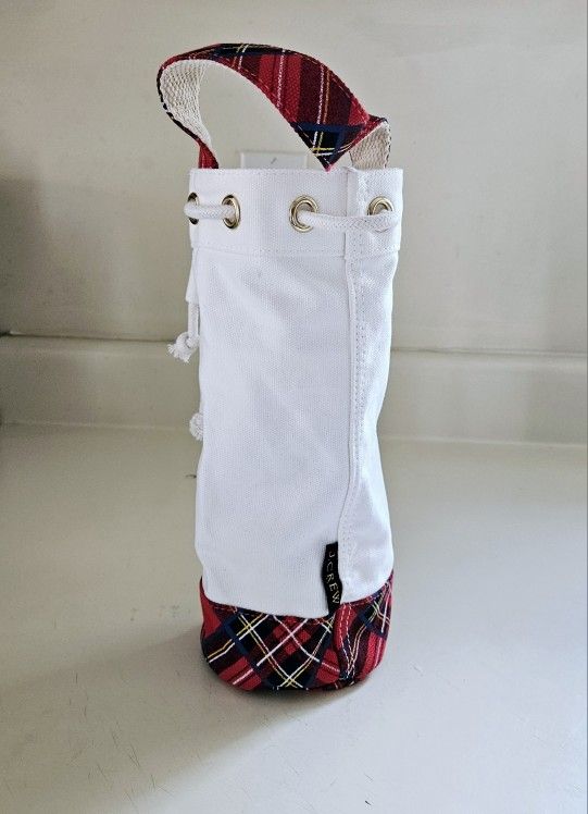 11" J Crew White Canvas Water Bottle Tote Carryall Bag with Red Tartan Bottom and Handle and Rope Tie Closure. 4" Wide. Pre-owned in excellent conditi