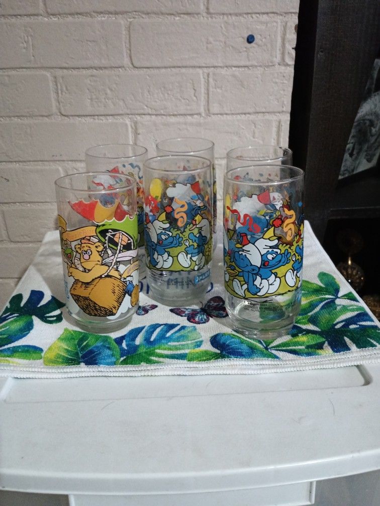 Five 1983 Glass Smurf Cups. One Muppet Cup