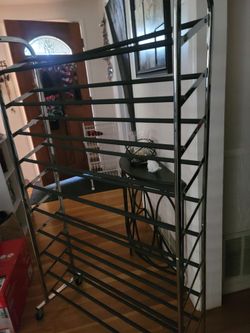 SHOE RACK HOLDS OVER 50 PAIRS SHOES HAS WHEELS TO ROLL AND LOCK WHEELS