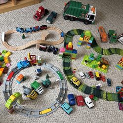 Assorted lot of wooden train tracks/trains, duplo legos & lego train tracks, magic tracks w/jeep etc