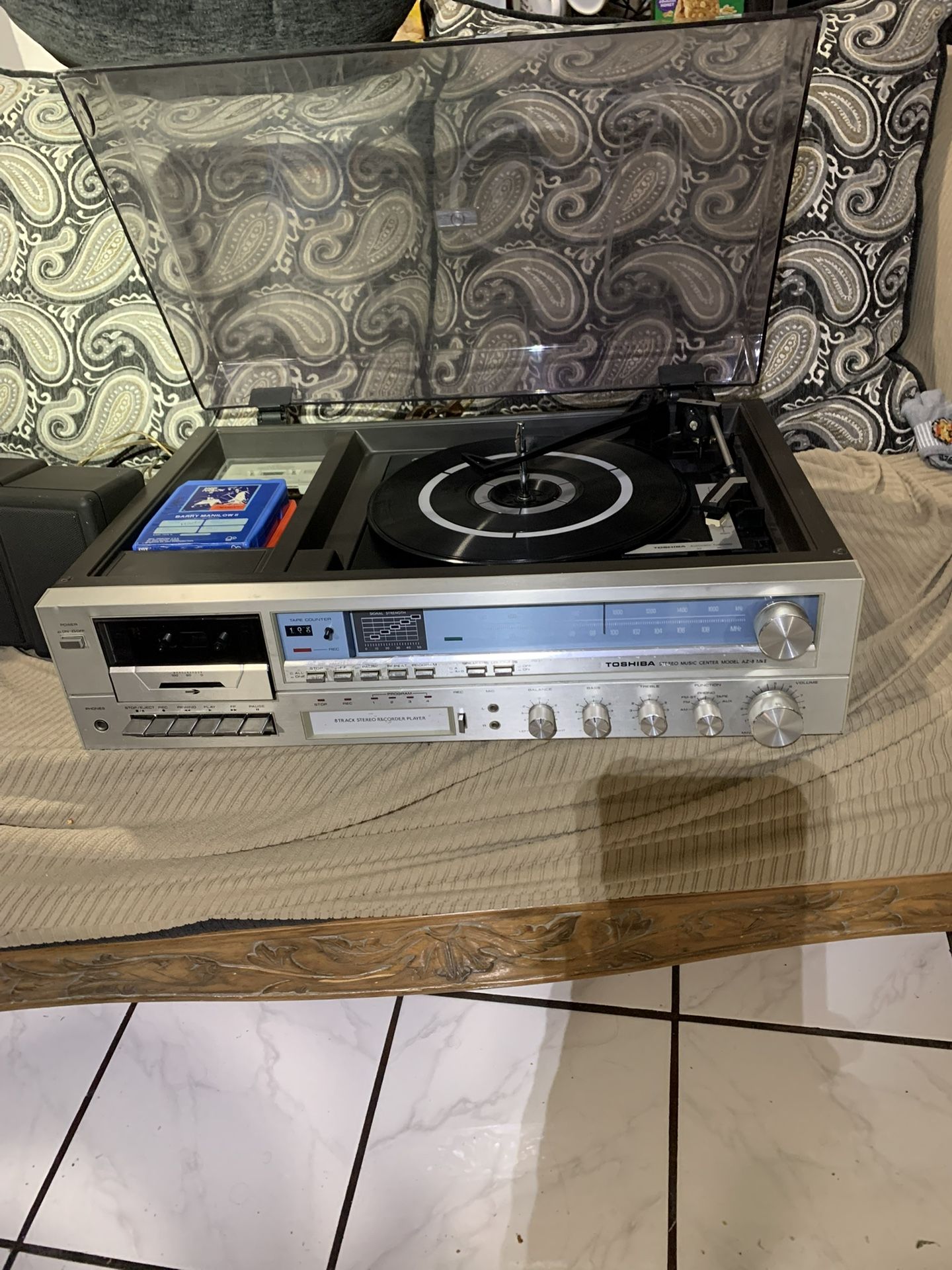 Vintage Toshiba Stereo radio, cassette, 8 track and record player with small speakers.. some scratches on dust cover. everything works
