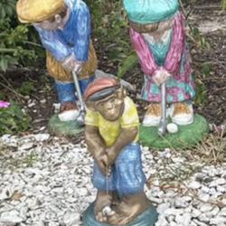 three cement golfing statues. extremely heavy and cannot move them.