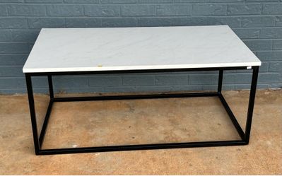 Coffee table with black metal base