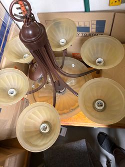 Beautiful Chandelier 27” Tall and the bottom plate is 15” with (6) round sucker cups
