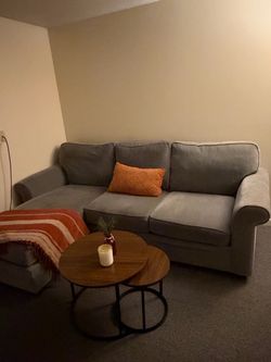 Gray L-shaped sectional sofa with a chaise lounge.