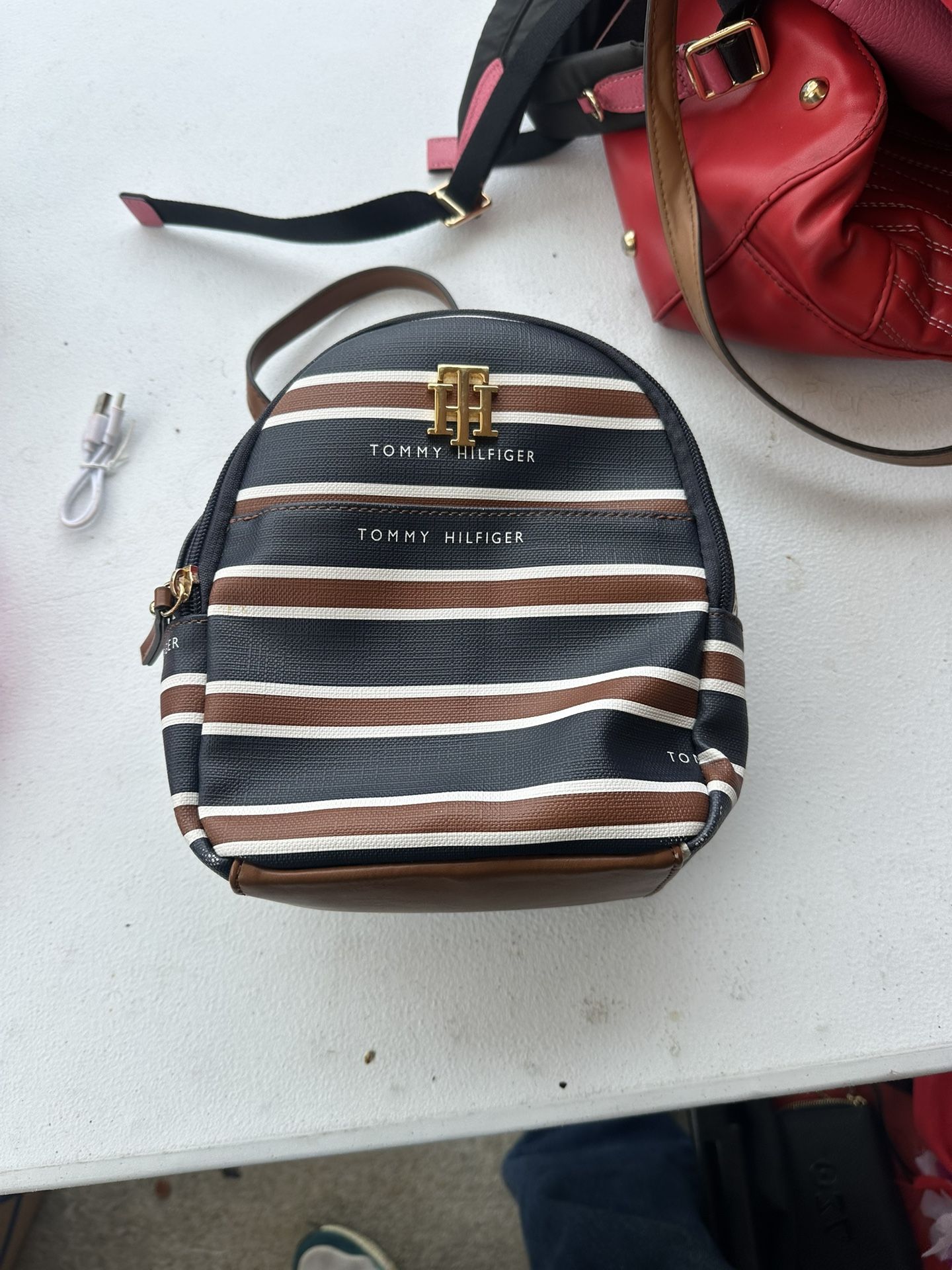 tommy hilfiger blue brown and white stripe backpack with front pocket
