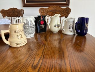 Six Vintage Drinking Pitchers