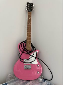 First Act ME515 electric guitar featuring a bright pink finish.