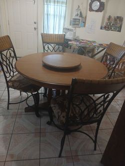 Beautiful wood table with 4 chairs and lazy susan