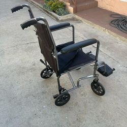 18 Inches Wide Transport/ Wheelchair In Excellent Condition Easy To Fold 