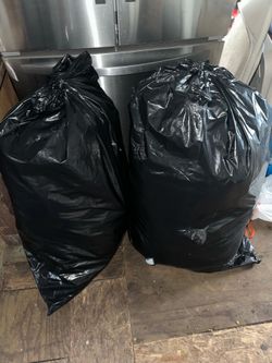 Two bags of women’s clothes sizes M-XL