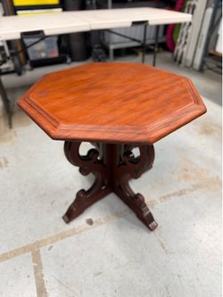 Victorian/Renaissance Revival carved mahogany pedestal table.”