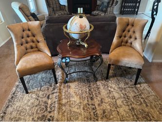 Two suede chairs and center table