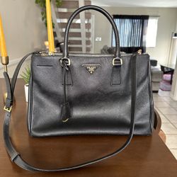 Black authentic Prada bag with original duster bag