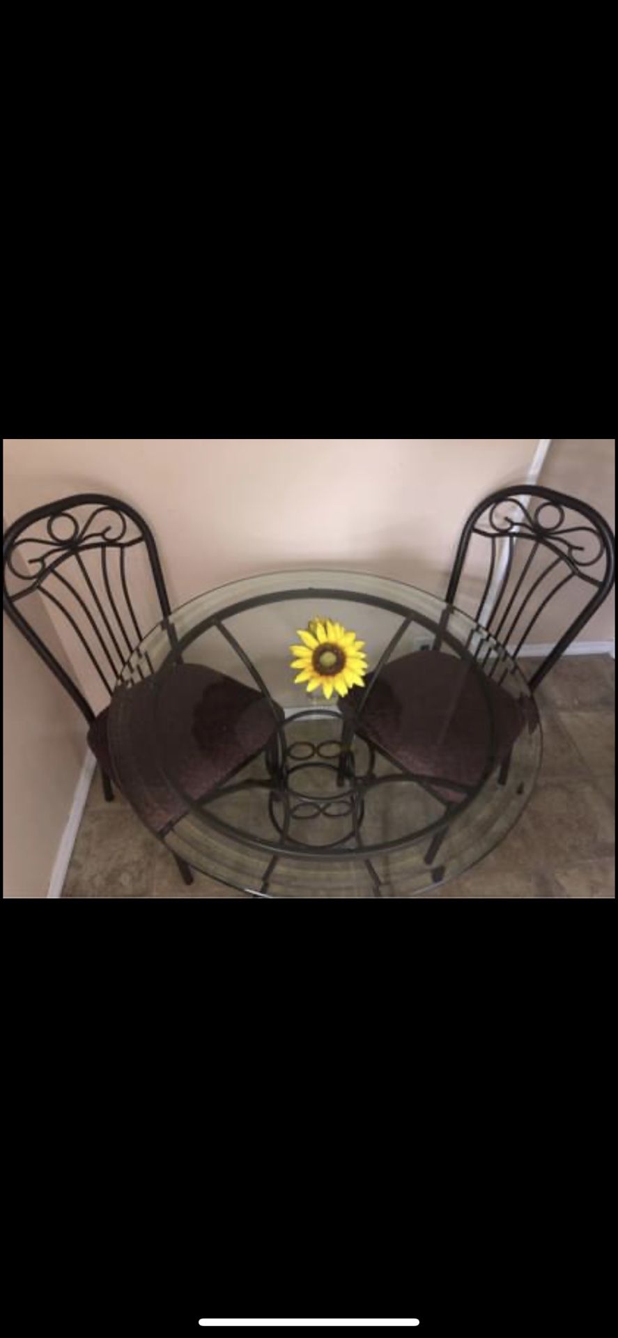 Round glass table and 2 cushioned chairs