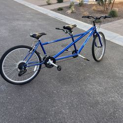 Pacific Dualie Adult Tandem Cruiser Bike, Two-Rider Bicycle for Men and Women, 26-Inch Wheels, 21-Speed, Linear Pull Brakes, Blue