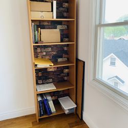 Bookcase/Shelf Unit. Very capacious. Excellent condition. Great bargain. Olden bricks pattern background. 71.25” tall. 24.75 x 9.75”.