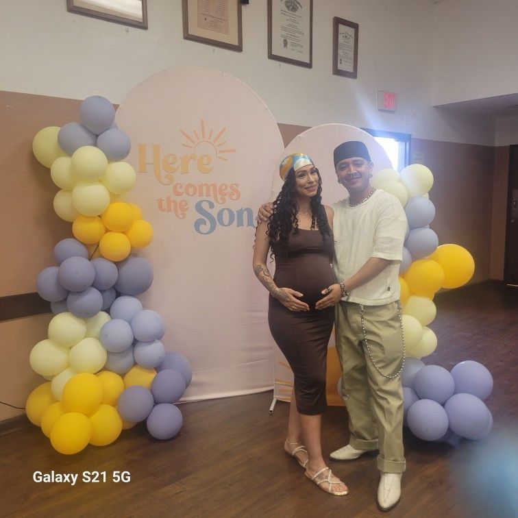 Baby Shower Back Drop With Alot Of Baby Shower Decorations And Accessories.