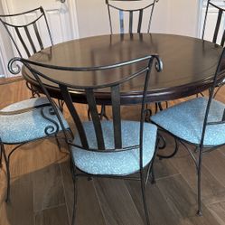 Round dining table with 6 chairs
