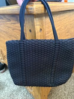 Nine West small black woven handbag featuring an all-over basket-weave texture and dual top handles