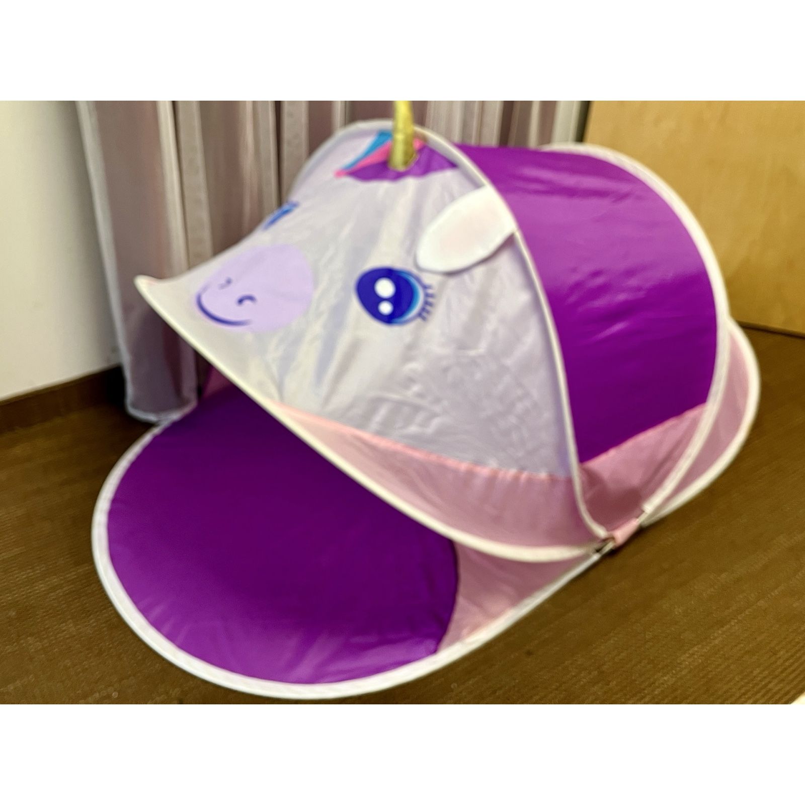 Purple kids play pop up tent with unicorn face. Folds up, indoor or outdoor play.