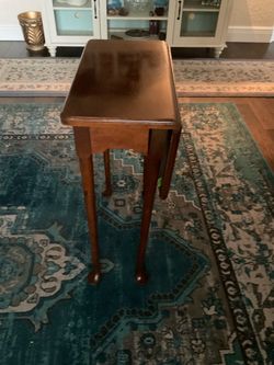 Vintage 18” square half drop leaf table. Stands 27” high.