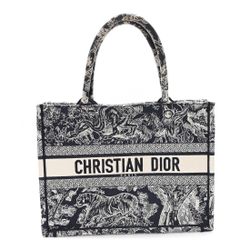 Dior Book Tote in a blue and white "Toile de Jouy Reverse" embroidered canvas