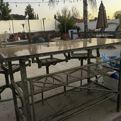 Metal bar top table with three metal chairs