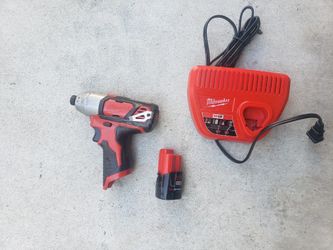 Milwaukee impact drill with battery and charger