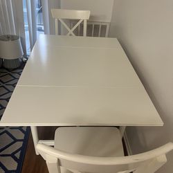 Folding kitchen table set with 2 chairs in good condition
