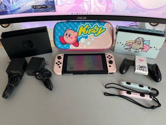 Nintendo Switch with case and extra dock in pink