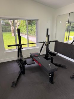 Rogue weight bench an spotter with bar bell