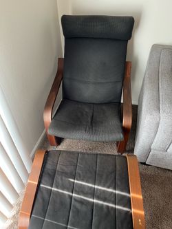 POANG - Black chair with ottoman