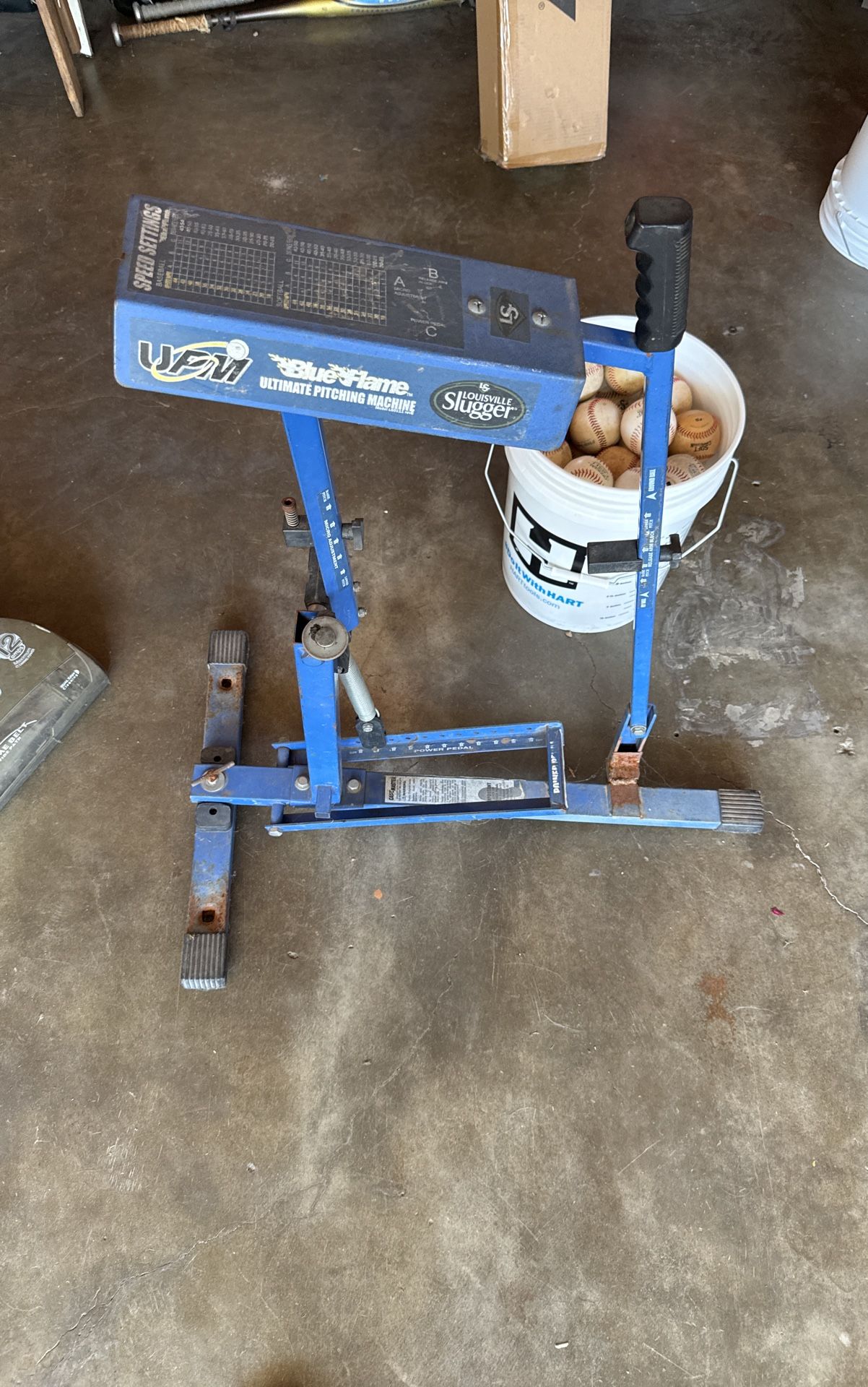 Blue Flame And Bucket Of Squishy Baseballs. Machine Works Better Then New Ones. Used It This Past Season.