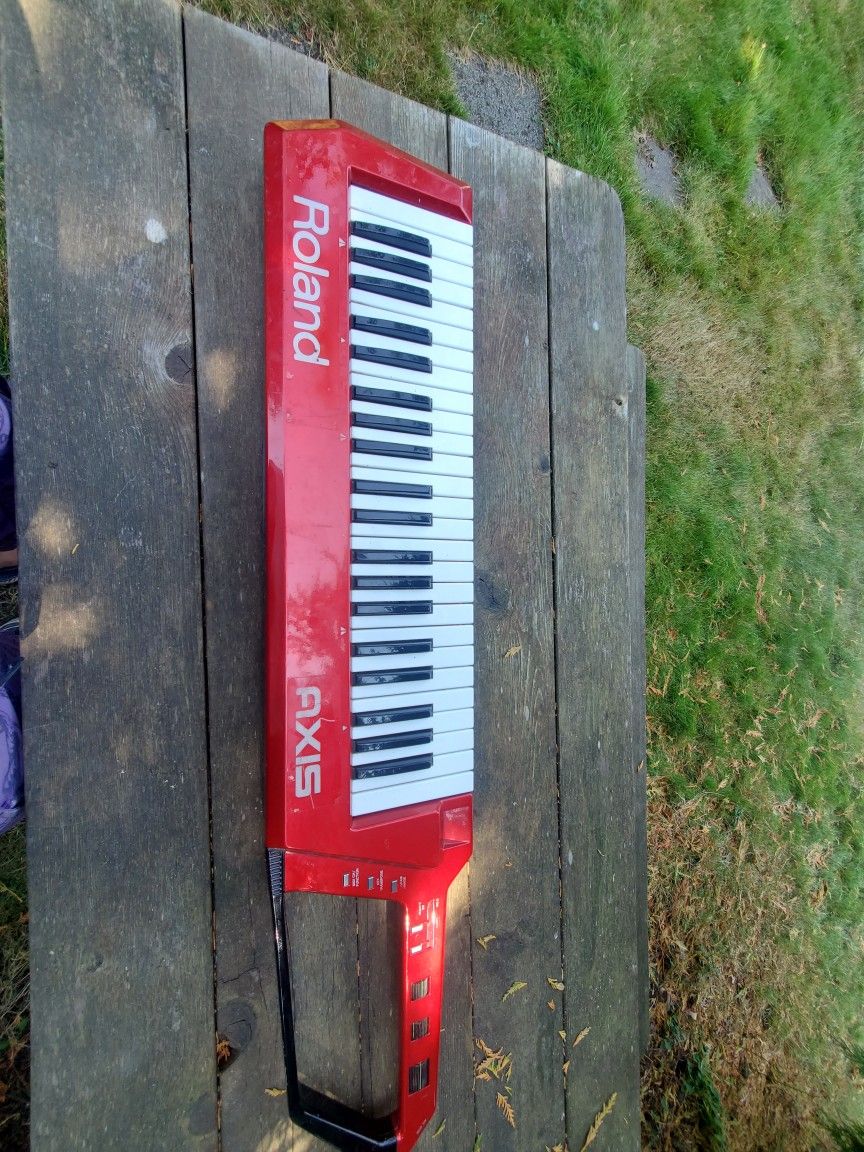 Roland Axis-1 Red Midi electronic keyboard needs cord there is no cord Bring your own power cord for testing. Prices firm